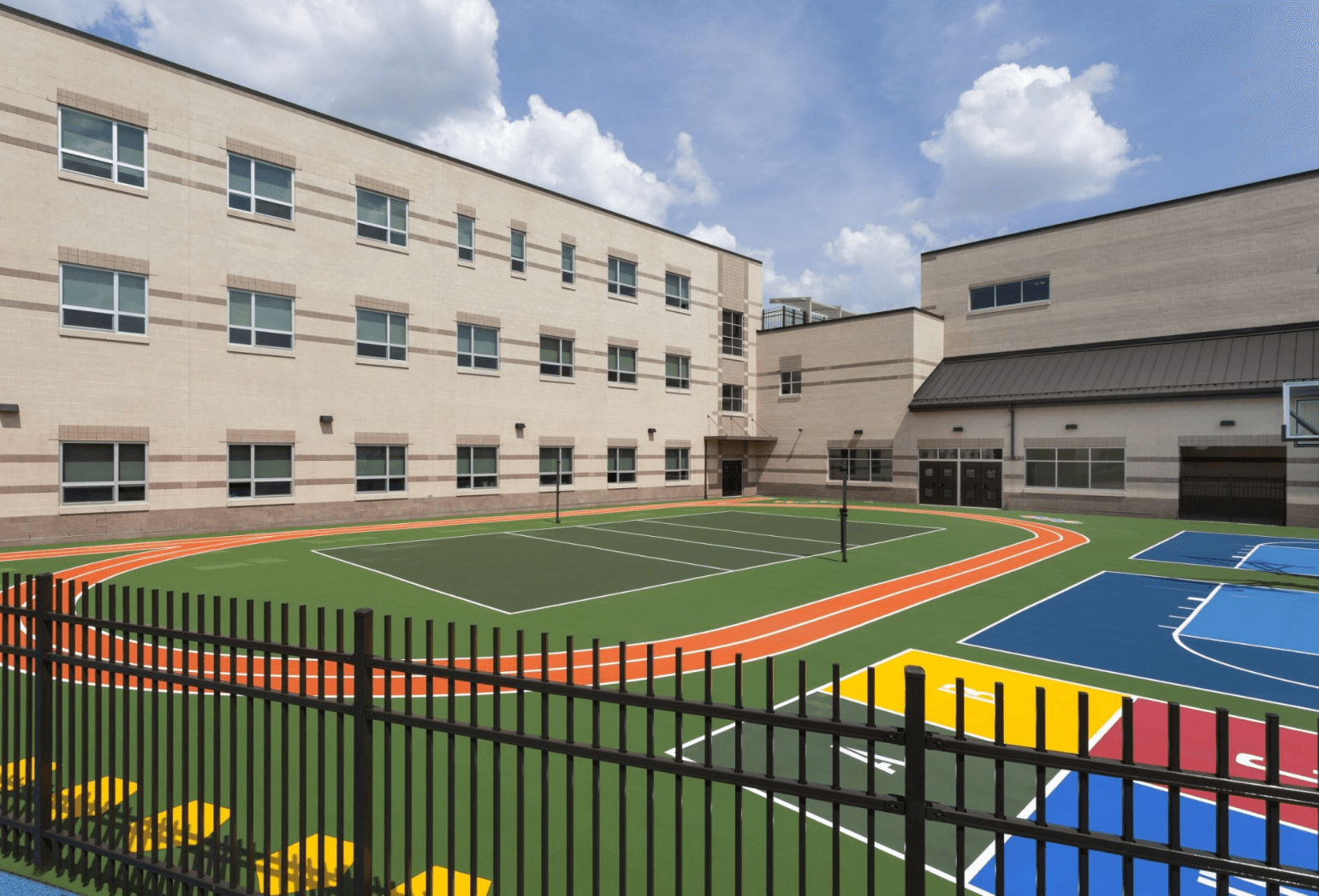 A design of an outside area for a Newark, NJ, school with a track, basketball court, and other grounds for games.