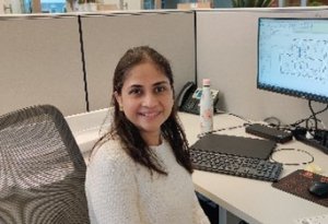 Sonali Dalvi, Project Coordinator, at SSP Architectural Group, posing for a desk at her cubical.