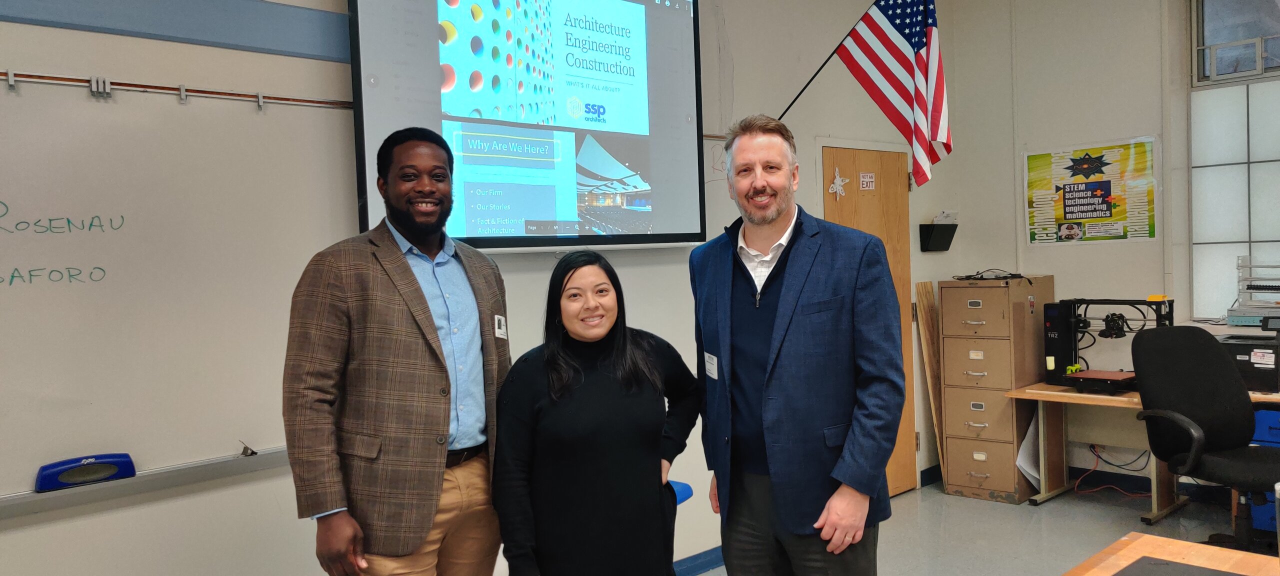 SSP Architects Principal Marcus Rosenau and Designer, Jude Saforo posing for a photo with West Orange High School teacher after speaking to her class about the architecture industry.